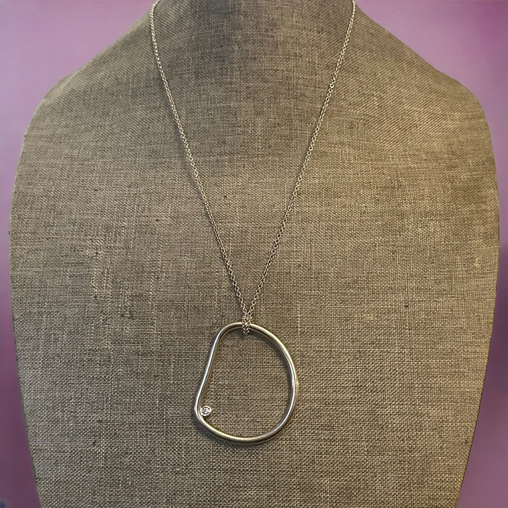 Cole Haan silver tone lopsided hoop pendant necklace
